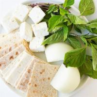 Persian Feta · Solt goat cheese served with garden basil.
