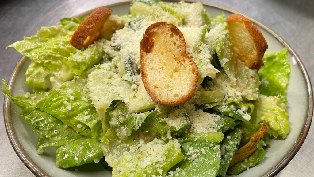 Caesar Salad · Romaine, traditional hand made anchovy egg dressing and Parmesan cheese, croutons. Contains dairy, gluten, and raw egg. Can be served without croutons.