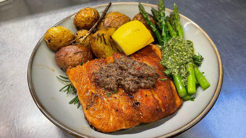 Canadian Salmon Entree · Organic & sustainably farmed Canadian Salmon, pistou sauce, and veggies.

With your choice of: herb rice, mashed potatoes, roasted potatoes, just veggies, or mixed green salad.
