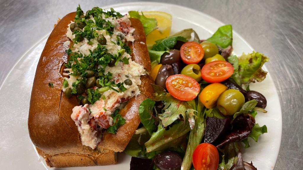 Lobster Roll Sandwich · Lobster Roll Sandwich. Maine lobster meat, capers, aioli, toasted Wedemeyer Kaiser roll, served with mixed green salad. Contains gluten (bun).