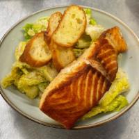 Salmon Caesar Salad · Caesar Salad with Filet of Salmon romaine, anchovy dressing, parmesan, croutons.