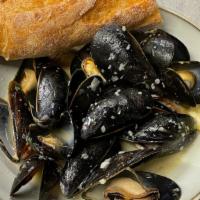 Prince Edward Island Mussels · Prince Edward Island mussels in pernod shallot butter broth with bread.