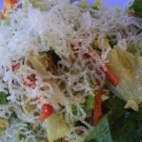 Traditional Caesar Salad · Romaine lettuce tossed in a creamy Caesar dressing, garlic croutons and shaved reggiano parm...