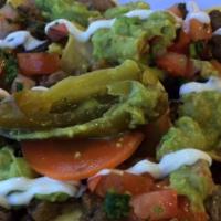 Oscar's Nachos with Meat · Choice of meat with refried beans, jack cheese, sour cream, pico de gallo, freshly made guac...