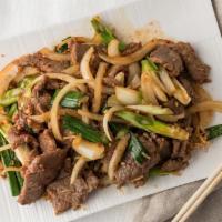 #603. Mongolian Beef · Hot & spicy. Sautéed beef with onions and green onions.