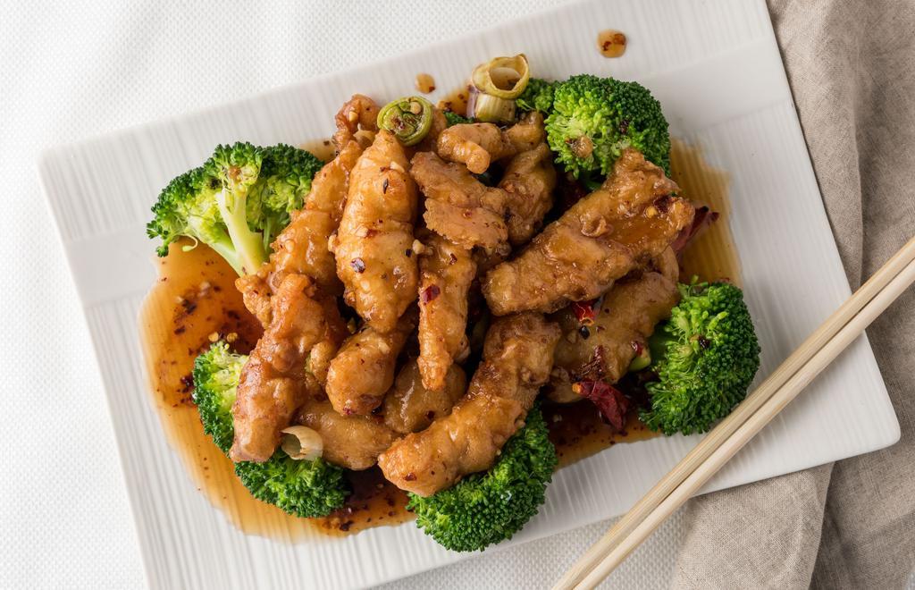 #C602. General Tsao's Chicken · Hot & spicy. Stir fried or Deep fried chicken with house special sauce with broccoli surrounded.