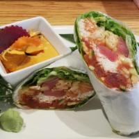 Sushi Burrito · Raw.  shrimp tempura, crab, spicy tuna, seared tuna, salmon & avocado, wrapped in iceberg le...