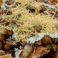 Samosa Chaat · Vegetarian. Nut free. Potato filled samosas topped with channa (chickpeas), yogurt, sweet an...