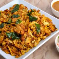 Kothu Parotta · Shredded paratha stir fried with choice of curry and essential spices.