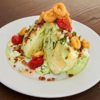 Wedge Salad · Bacon, Haystack Shallots, Blue Cheese Crumbles, Confit Tomato, Herbed Buttermilk Dressing