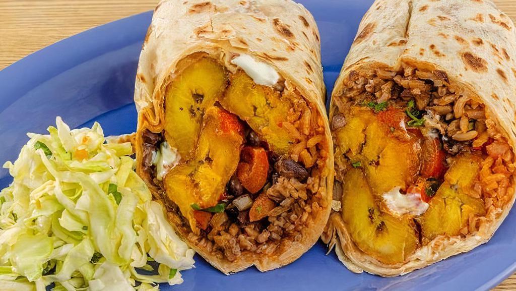 Fried Plantain & Black Bean Burrito · Toasted tortilla filled with fried plantains, black beans, jack cheese, roasted red bell peppers, rice, sour cream, smoky chile salsa, pico de gallo, chopped onions & cilantro.