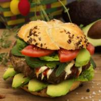 California Burger · 1/3 pound juicy grilled beef patty served on a toasted bun with avocado, sun-dried tomatoes,...