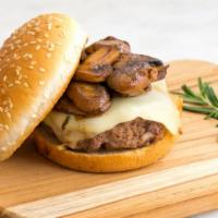 Mushroom Swiss Burger · 1/3 pound juicy grilled beef patty served on a toasted bun with sautéed onions and melted Sw...