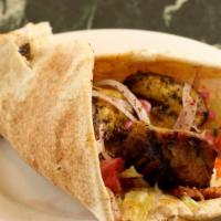 Chicken Kabob Sandwich · Chunks of chicken breast grilled with onions, parsley, and garlic. Served in pita bread.