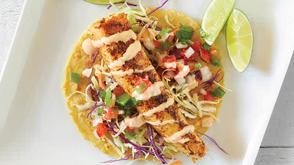 Blackened Fish Taco · Blackened wahoo, coleslaw, chipotle dressing, pico de gallo, with lime.