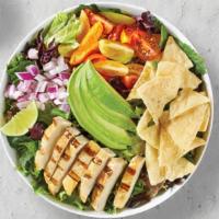 Avocado Green · Fresh grilled chicken breast, avocado, red onions, cherry tomatoes, corn chips on a bed of s...