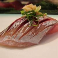 Saba (Mackerel) Sashimi · Sliced raw Mackerel fish served with daikon radish.