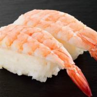 Ebi (Shrimp) Sashimi · Sliced cooked Shrimp served with daikon radish.