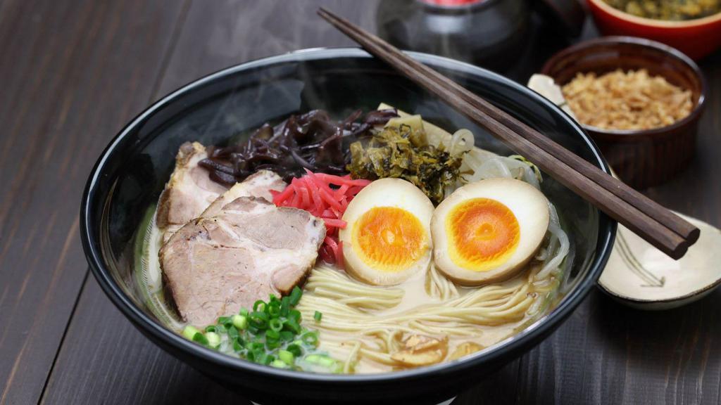 Pork Ramen Soup · Perfectly spiced noodles soup, made with sliced pork, green onions, seaweed, sesame seed, and a boiled egg.