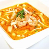 90. Tom Yum Soup · Spicy & sour soup w/vegetables, lemon grass, kaffir lime leaves, mushrooms, tomatoes & lime ...