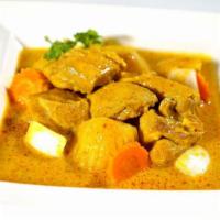 47. Yellow Curry · Yellow curry w/coconut milk, carrots, potatoes & onions, served w/cucumber salad