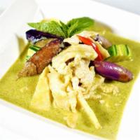 48. Green Curry · Spicy. Green curry w/coconut milk, eggplant, bamboo shoots, basil & chili.