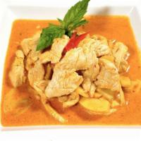49. Red Curry · Spicy. Red curry w/coconut milk, bamboo shoots, basil & chili.