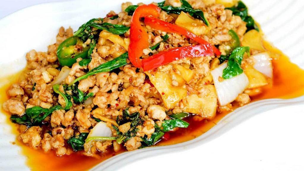 55. Spicy Basil · Sautéed sweet basil, bamboo shoot, chili, onions and garlic (Please choose meat, tofu or seafood)