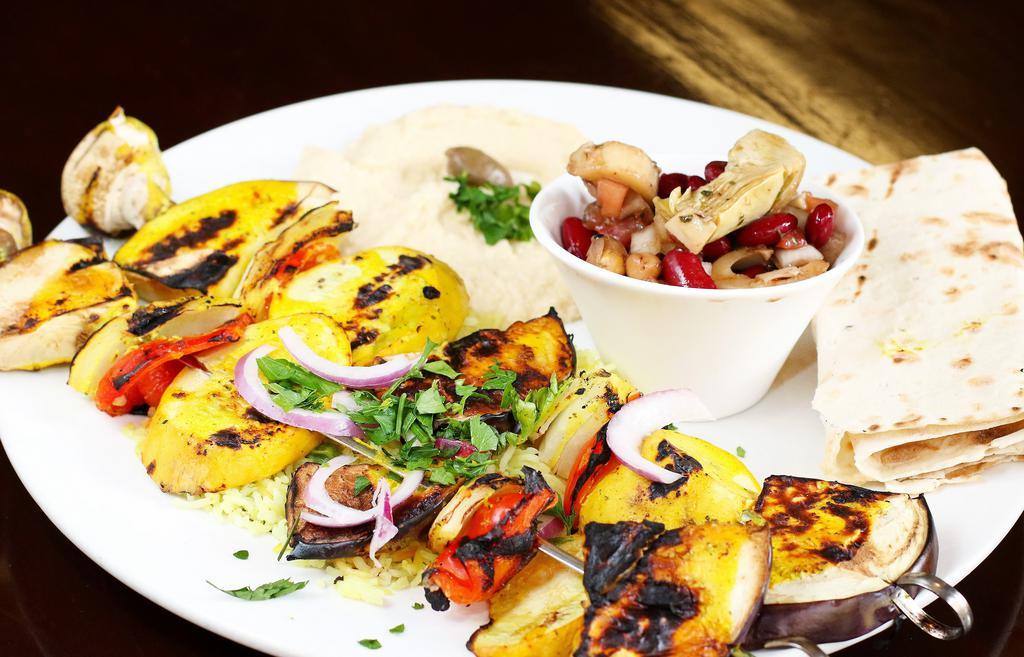 Veggie Kebab Plate · Vegetarian. Marinated eggplant, zucchini, mushrooms, bell peppers & onions with rice, hummus & salad.
