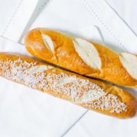 Warm Pretzel Stick · Slightly crispy on the outside, soft and warm on the inside. A perfect complement to your ch...