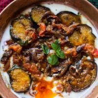 Borani Bademjan · Fresh eggplant mixed with yogurt, tasteful mint, whey and caramelized onions.