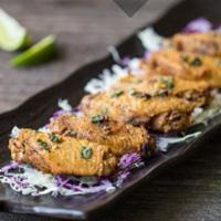 A4. Basil Lime Wings · Deep Fried Chicken Wings with Homemade Basil Lime Seasoning.