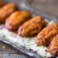 A5. Honey Chili Glazed Wings · Deep Fried Chicken Wings with Homemade Chili Sauce.