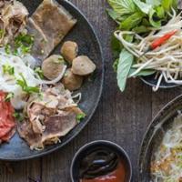N1. Pho Combo · Pho Noodle in Amazing Basil Style Beef Soup with rare steak, brisket, flank, shank, tendon, ...