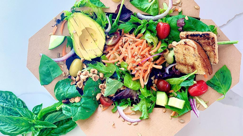 Garden Salad with Ranch Dressing · **Ranch Dressing: Has Egg, Dairy, Keto, Gluten Free** 
Organic mixed greens, avocado, cucumber, shredded carrots, cherry tomatoes, red onion, sunflower seeds, toasted hazelnuts, basil (Vegetarian) (sub ranch for balsamic dressing and its vegan)