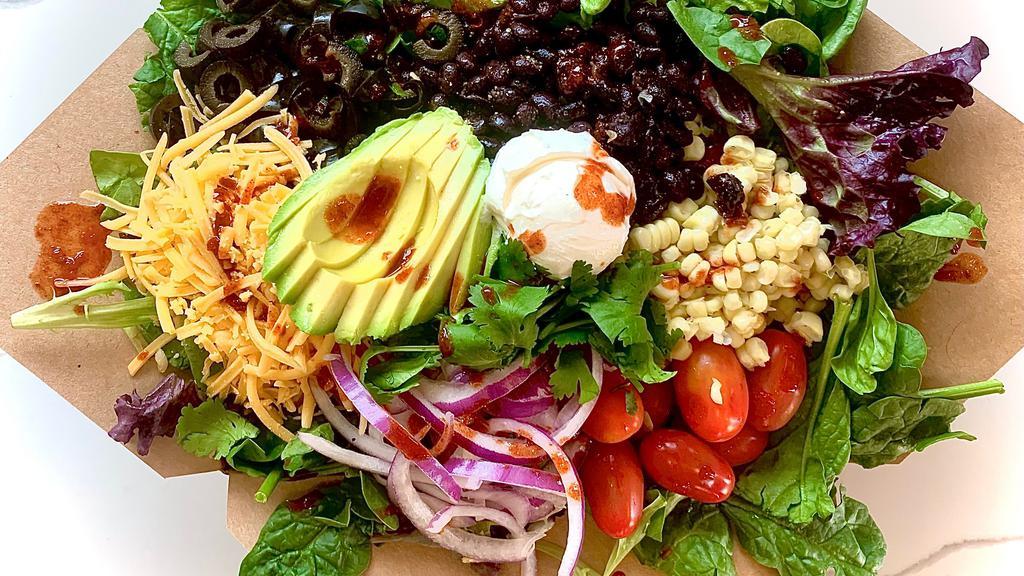 Southwest Salad  · **Cilantro Lime Dressing: Dairy, keto, gluten free**
Organic mixed greens, blackbeans, cheddar cheese, sour cream, corn, tomatoes, red onion,  avocado, black olives, Palo Alto Firefighters Pepper Sauce (SPICY), cilantro
