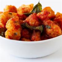 Five-Spice Popcorn Chicken · Hot and spicy. Deep-fried chicken chunks with basil leaves in our five- spice powder.