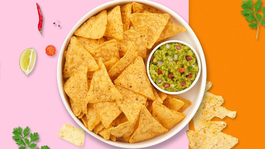 Holy Guacamole & Chips · A heaping scoop of fresh guacamole and warm tortilla chips