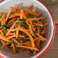 Spicy Carrot Salad (v) · Shredded carrots and parsley with a cumin, coriander, and chili dressing. Vegan.