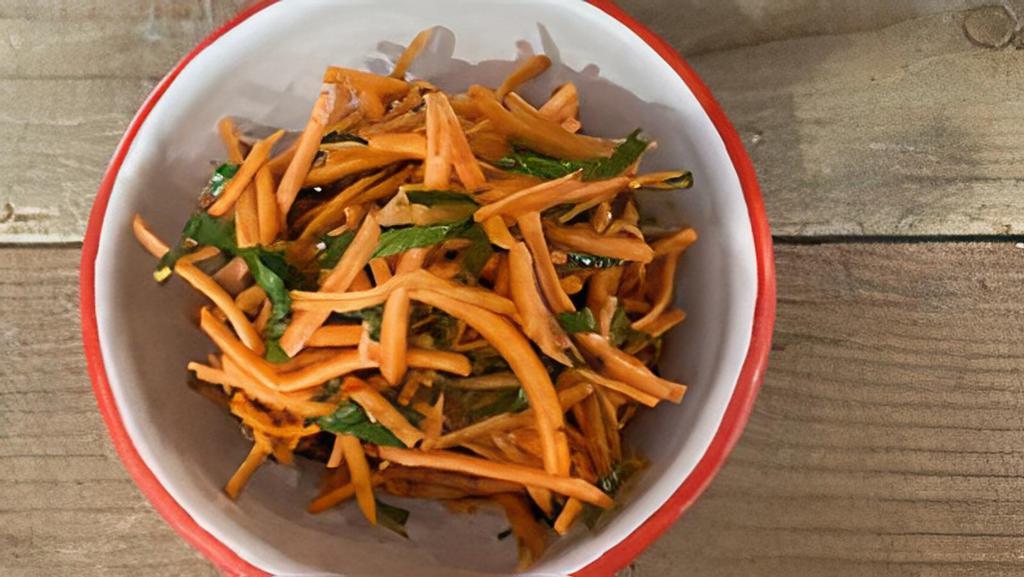 Spicy Carrot Salad (v) · Shredded carrots and parsley with a cumin, coriander, and chili dressing. Vegan.