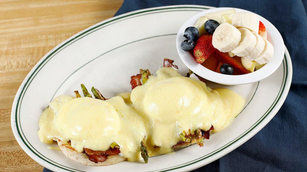 Eggs Benedict · 2 poached eggs with Canadian bacon on English muffin, topped with hollandaise sauce.
