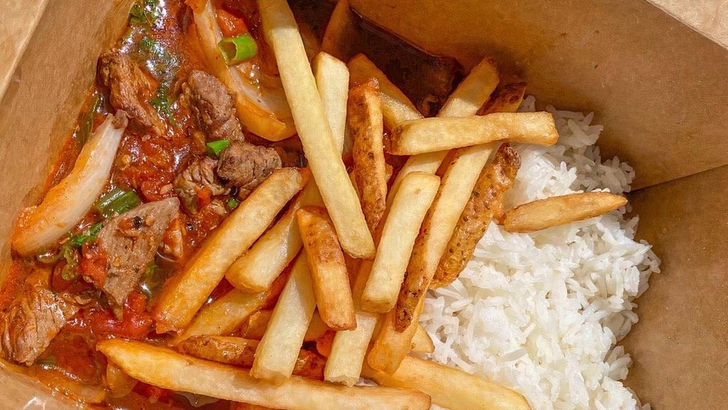 Bowl Lomito · Stir-fried beef tenderlion with tomatoes, onions, cilantro & soy sauce, topped with fries.