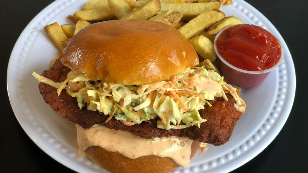 The Nashville Fried Chicken Sandwich · Buttermilk fried chicken coated in our Nashville hot seasoning. Topped with our sweet and spicy slaw, sriracha mayonnaise, and served on a toasted bun.