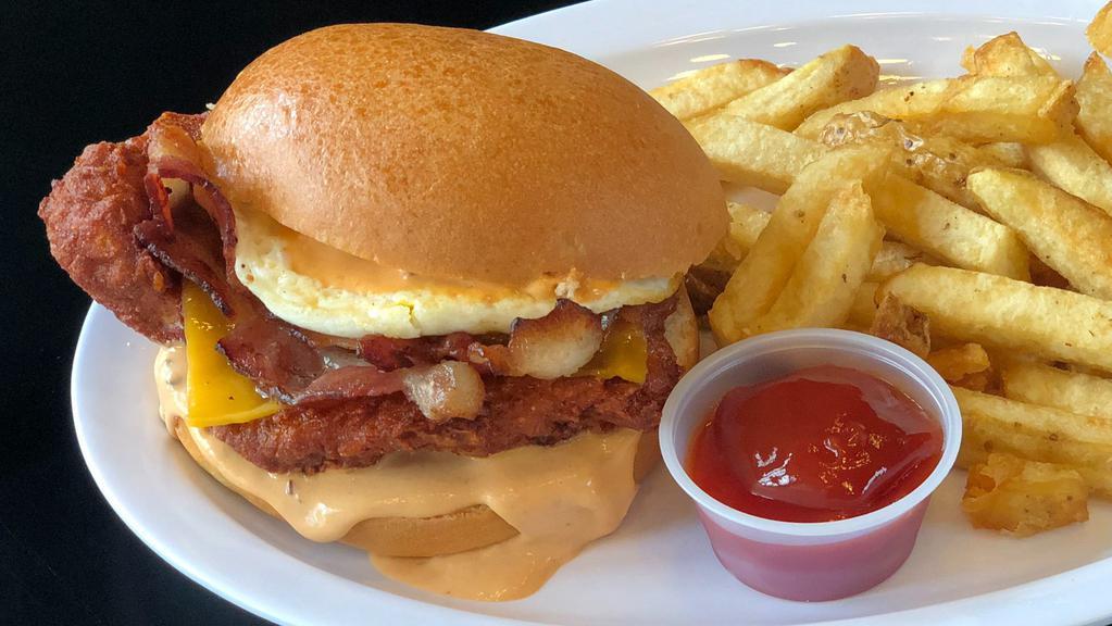 Rise & Shine Fried Chicken Sandwich · Buttermilk fried chicken, bacon, Cheddar, fried egg, and served on a toasted bun.