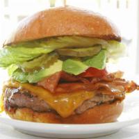 The New York Burger · Bacon, Cheddar cheese and avocado served on a perfect brioche bun with caramelized onions, c...