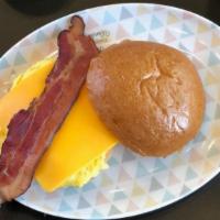 Egg, Cheddar & Bacon Breakfast Sandwich · Two eggs scrambled, bacon, Cheddar cheese on a brioche bun.