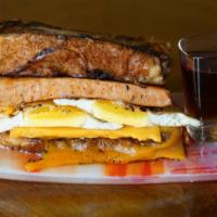 Sausage, Egg, & Cheddar French Toast Sandwich · The breakfast trinity available all day.