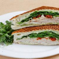 Turkey Panini · Oven-roasted turkey, basil pesto, provolone cheese, tomatoes topped with fresh spinach on fo...