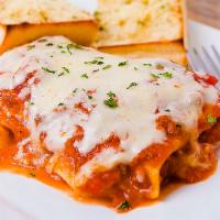 Lasagna Della Casa · Layered pasta with meat & Italian cheese, baked in red sauce, topped with mozzarella.