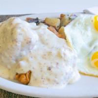 Country Fried Steak Breakfast · Country fried steak, biscuit covered with gravy, two eggs, & hash browns or country potatoes